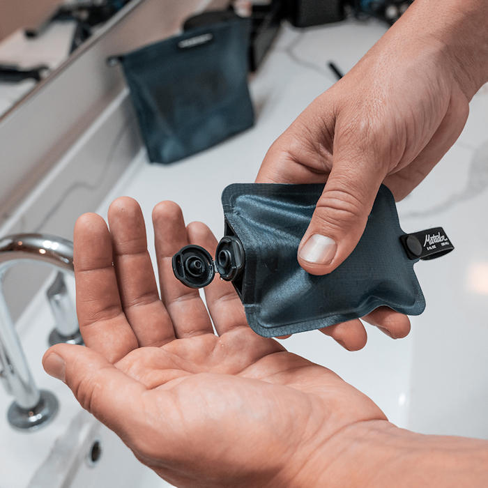 FlatPak Toiletry Bottle in use